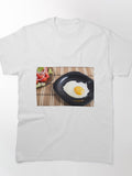Close-up top view on a black plate with a fried egg Classic T-Shirt