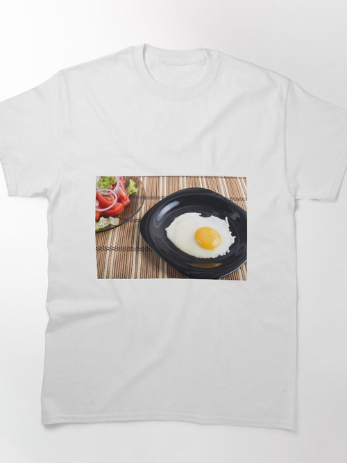 Close-up top view on a black plate with a fried egg Classic T-Shirt