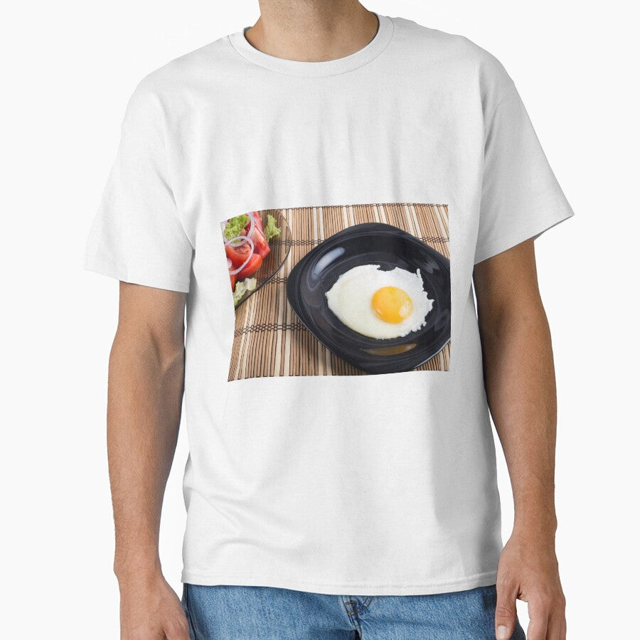 Close-up top view on a black plate with a fried egg Classic T-Shirt
